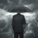 Trouble ahead concept, Businessman with umbrella standing in the