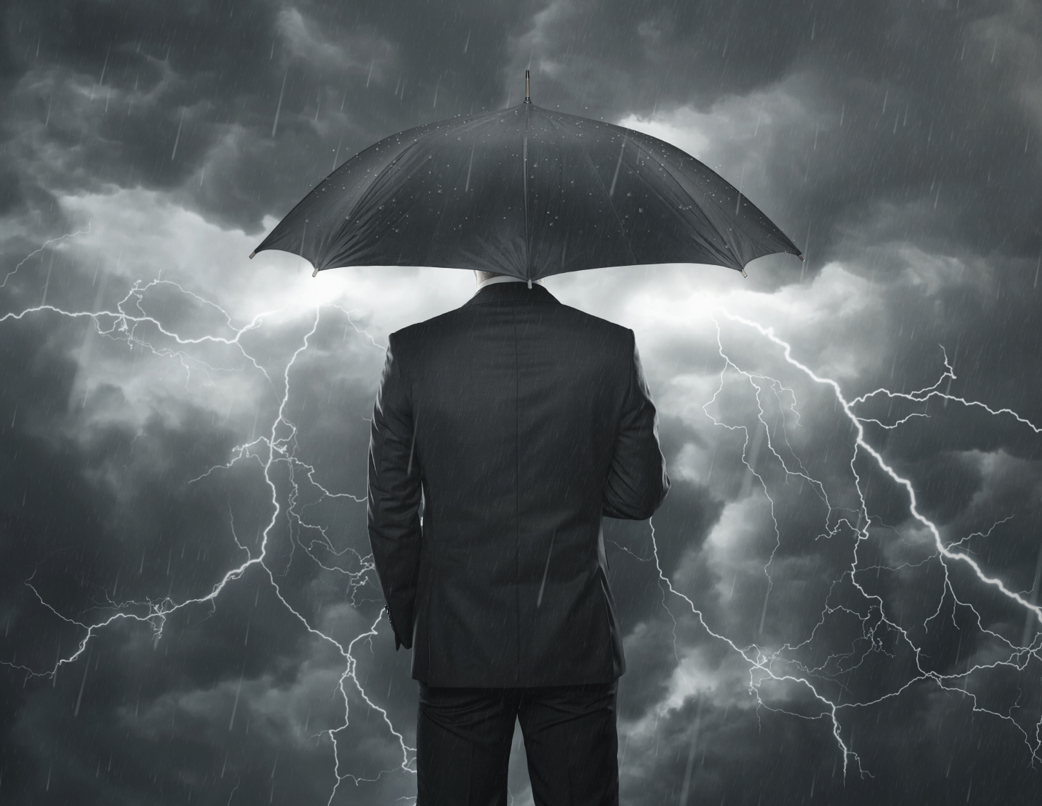 Trouble ahead concept, Businessman with umbrella standing in the